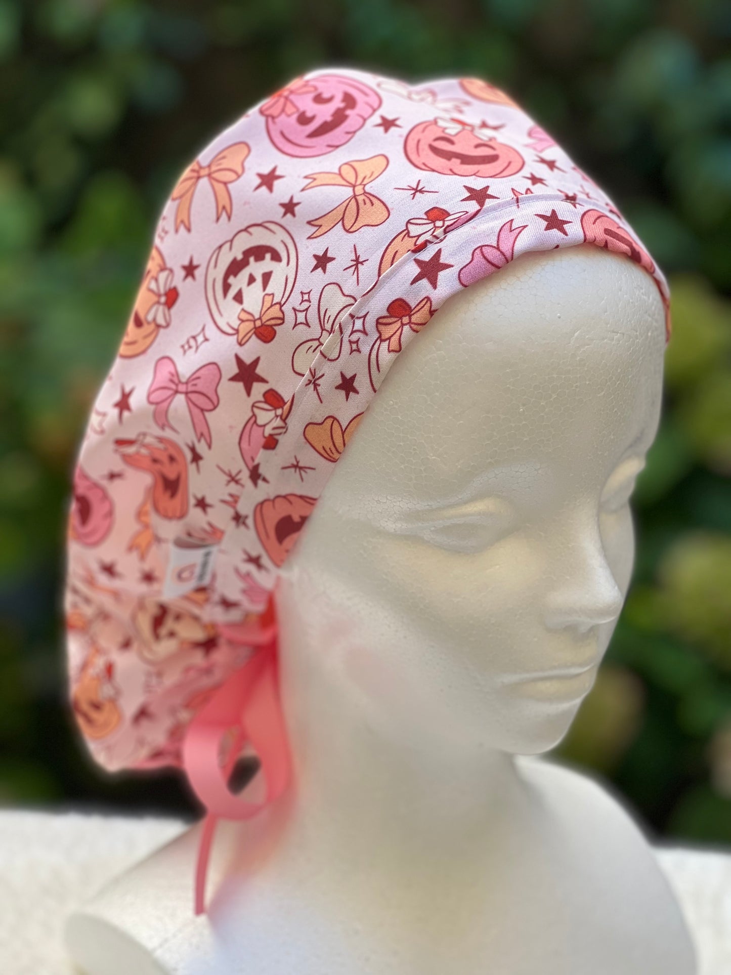 Pink pumpkin with bow scrub cap