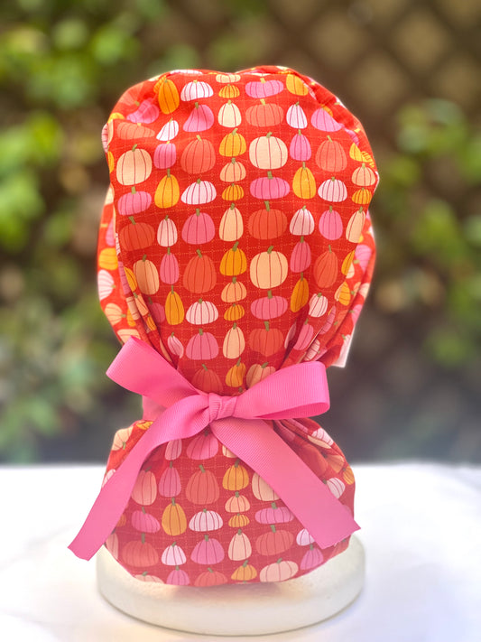 Pink pumpkin in orange Ponytail scrub cap