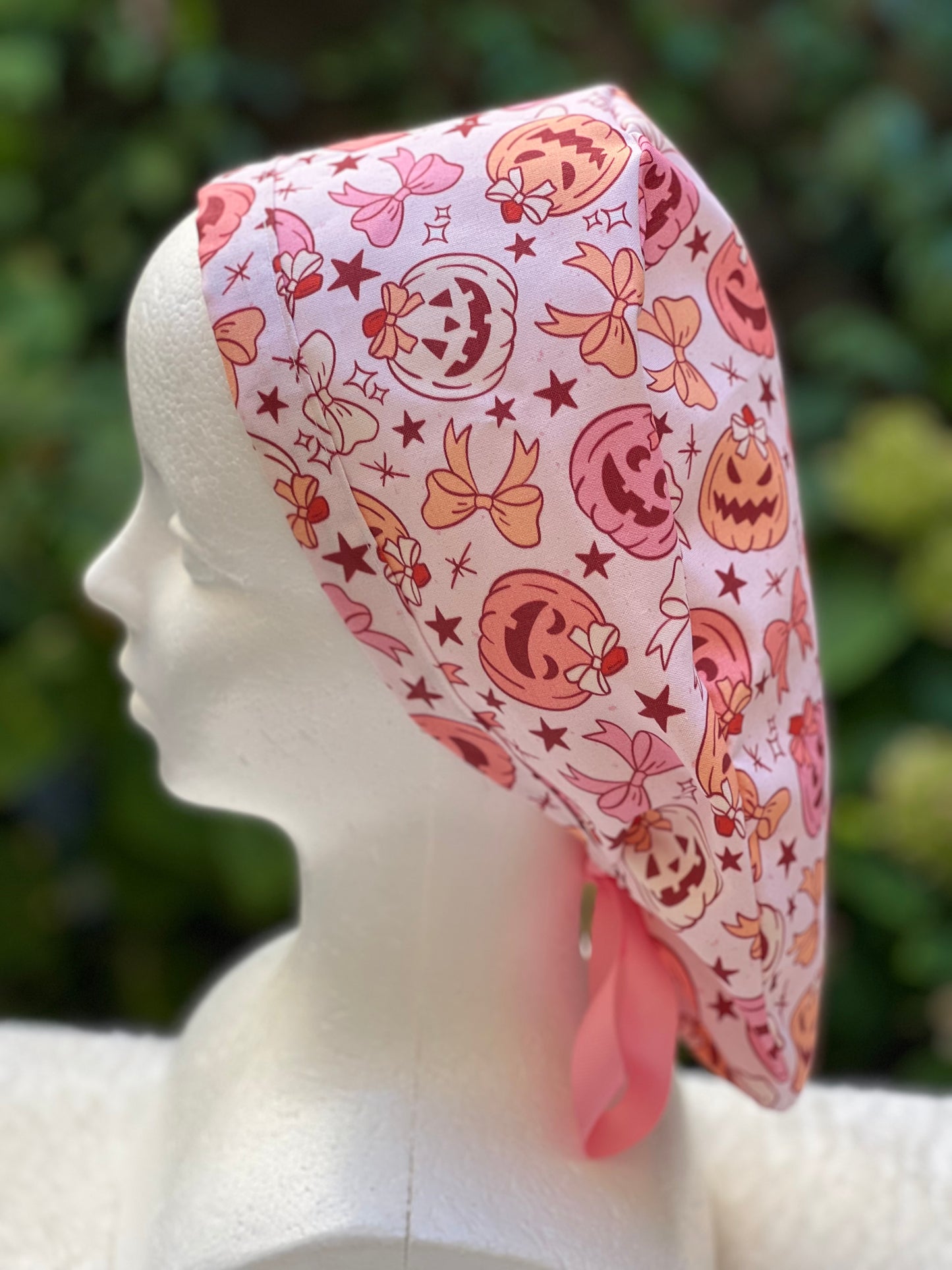 Pink pumpkin with bow scrub cap