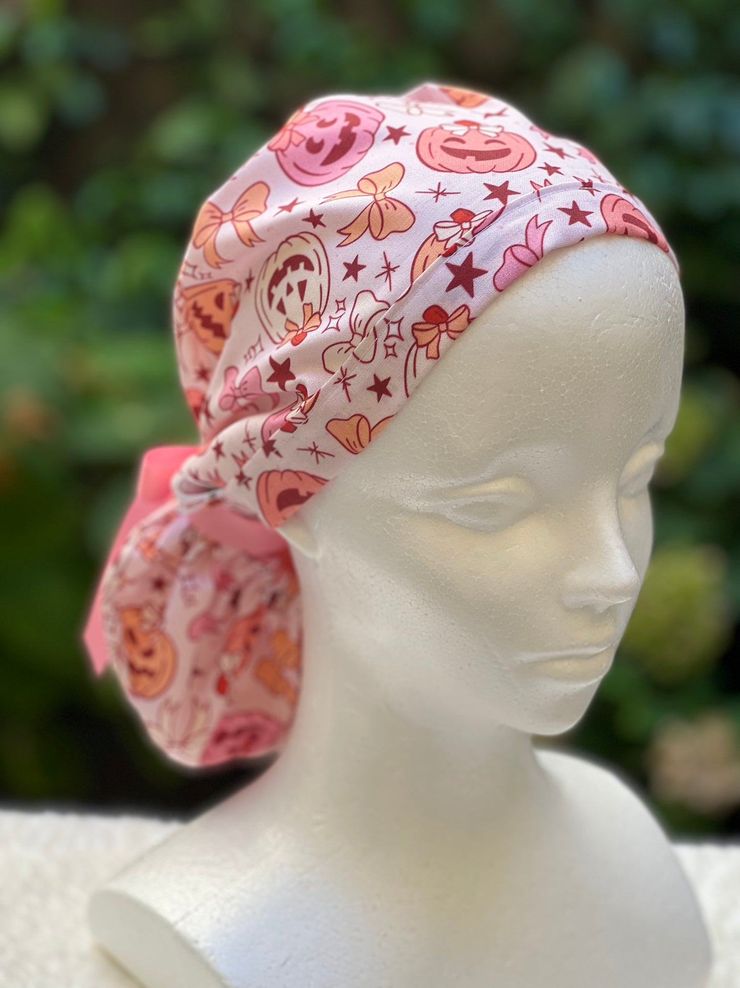 Pink pumpkin with bow scrub cap