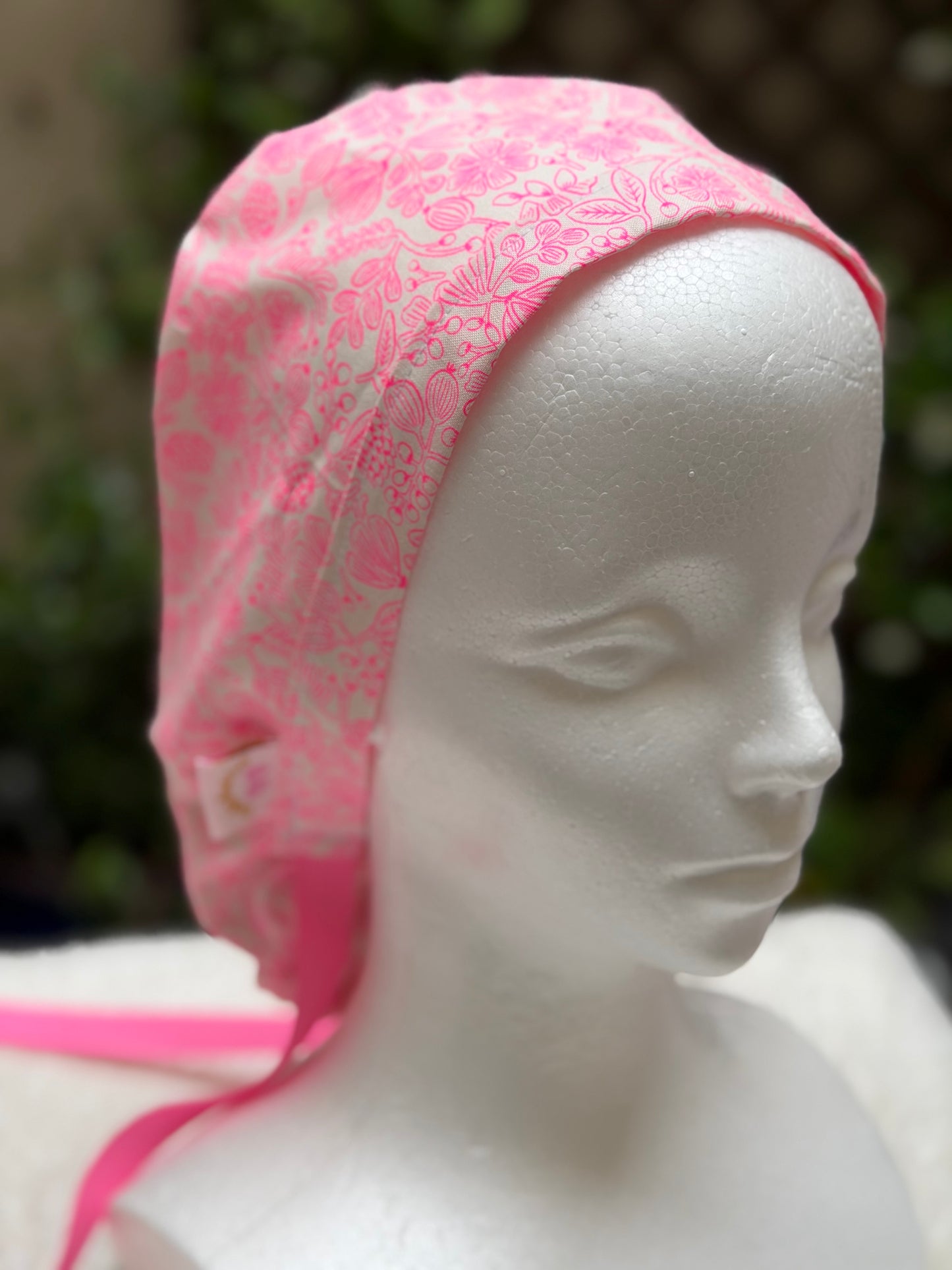 Neon pink ponytail scrub cap