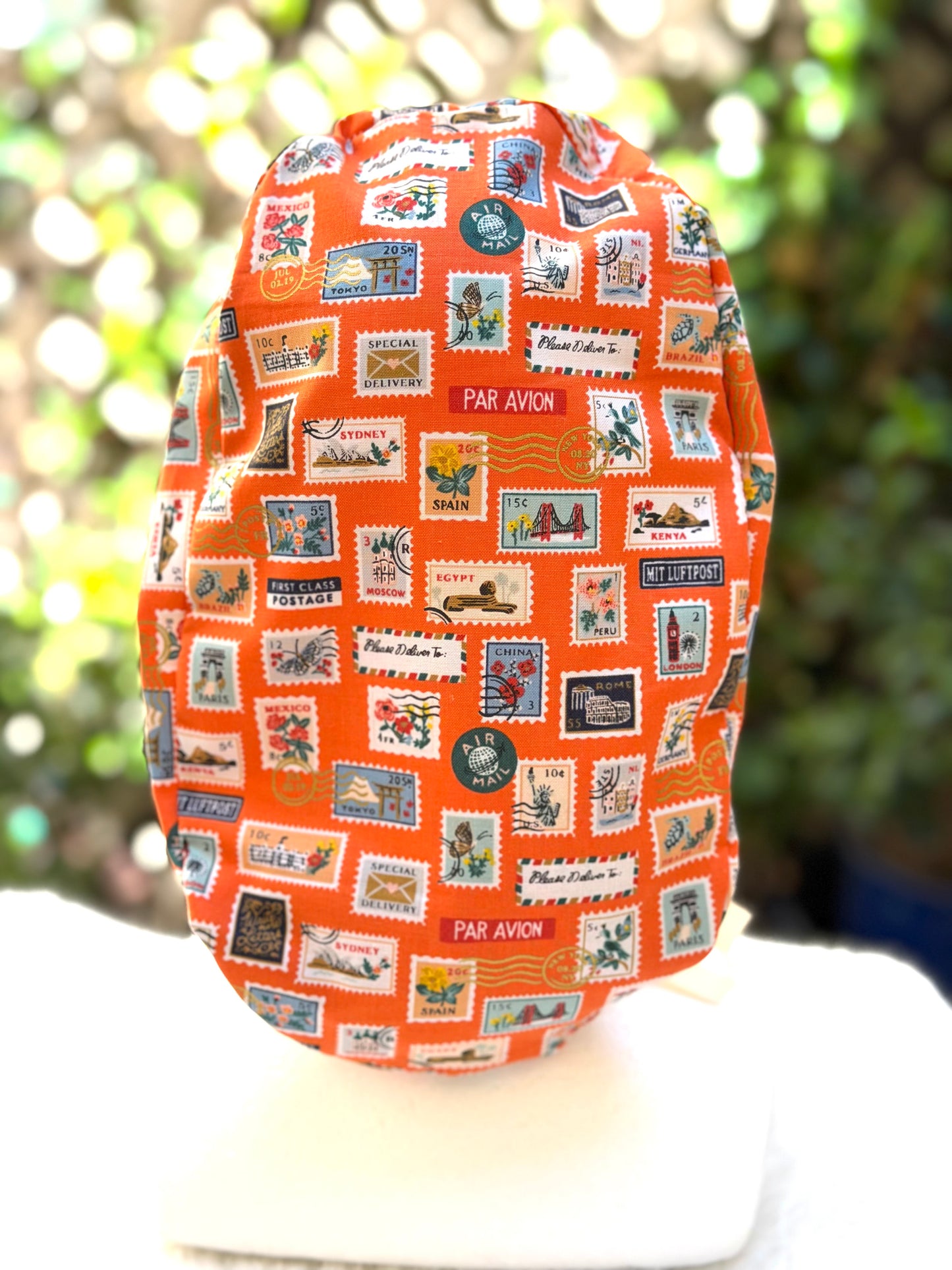 Orange postage stamps ponytail scrub cap