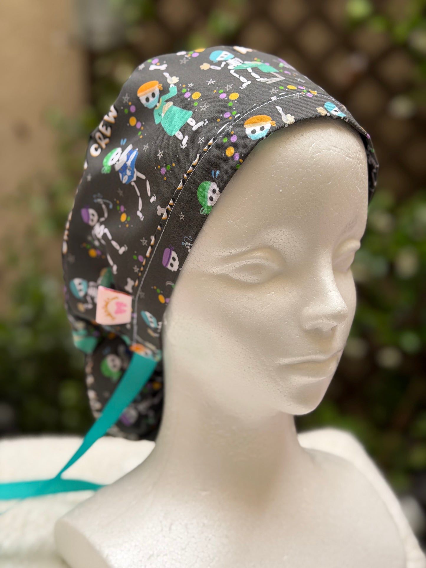 The Skeleton Crew Ponytail Scrub Cap