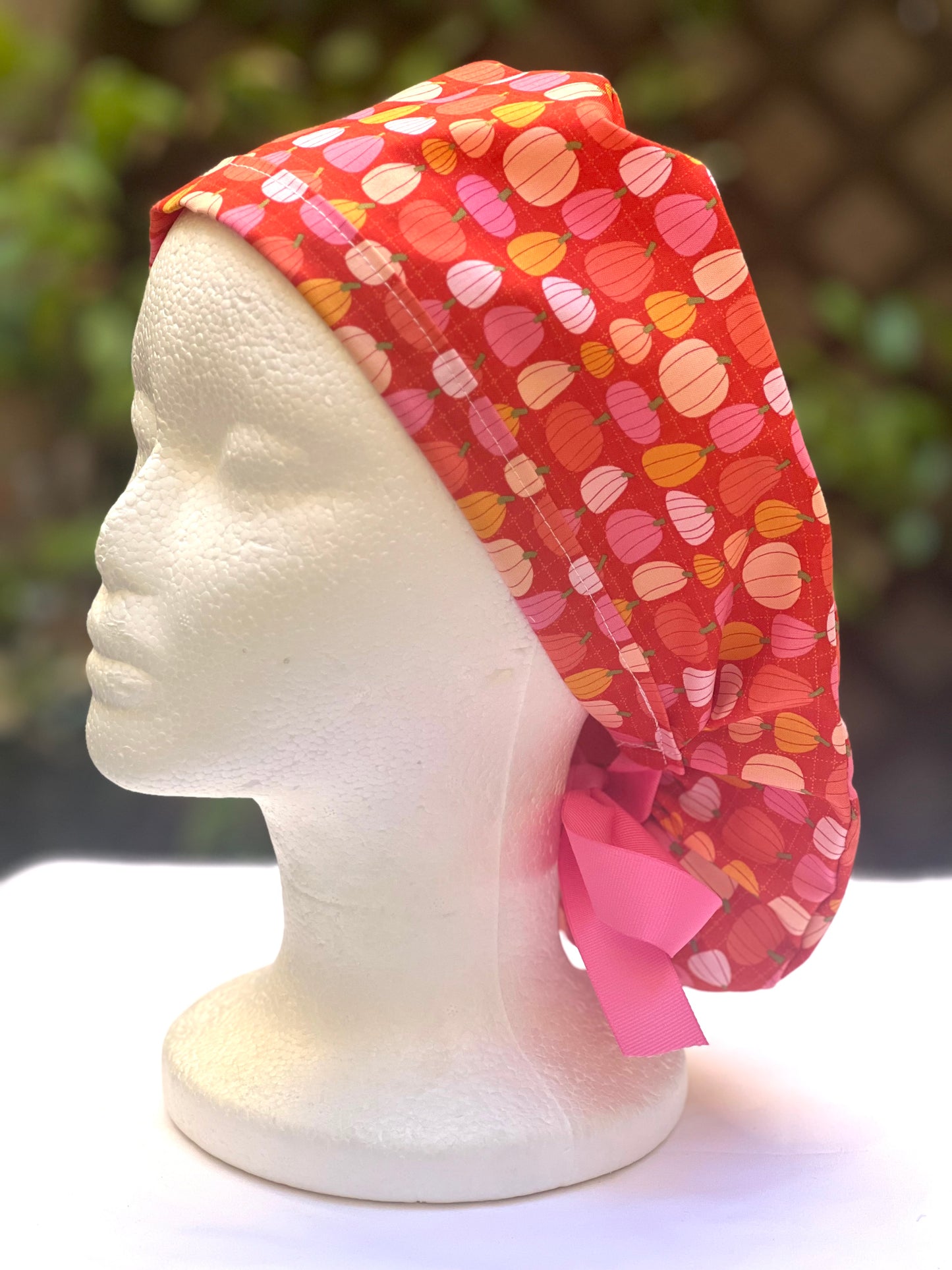 Pink pumpkin in orange Ponytail scrub cap