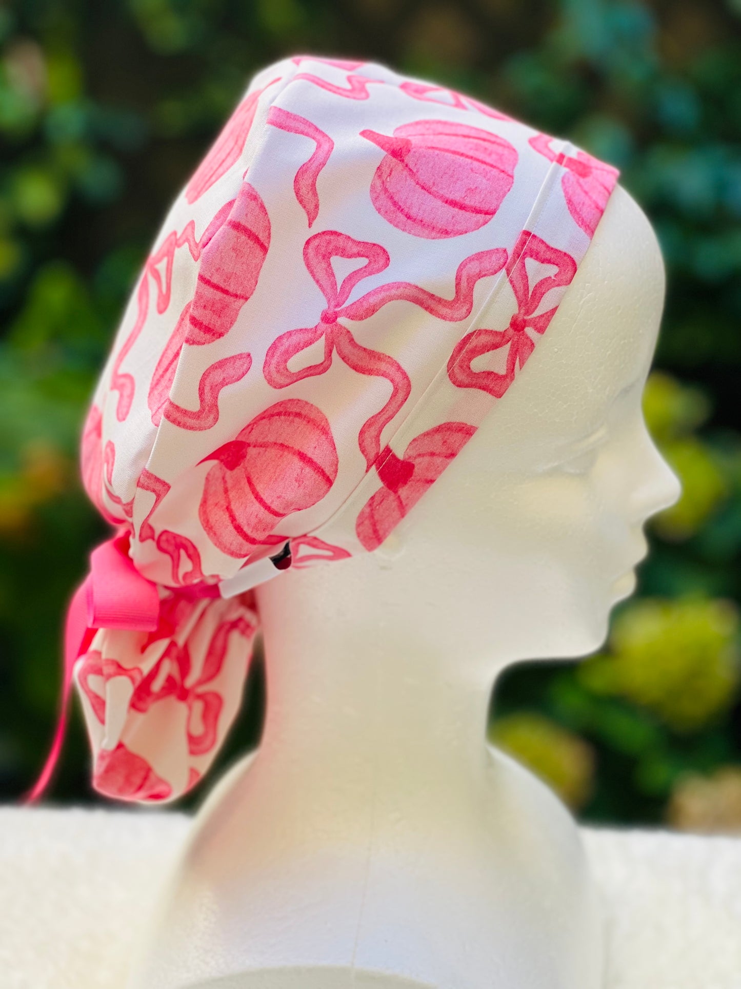 Pink pumpkin with bow scrub cap