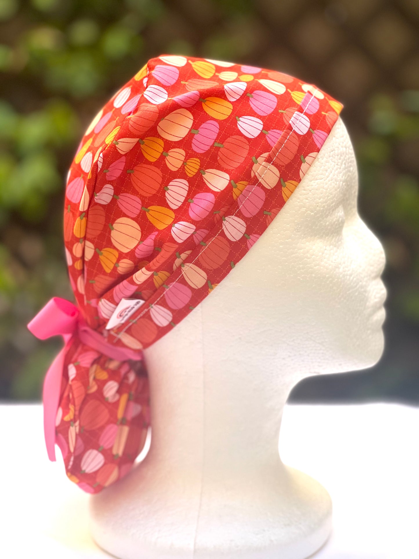 Pink pumpkin in orange Ponytail scrub cap