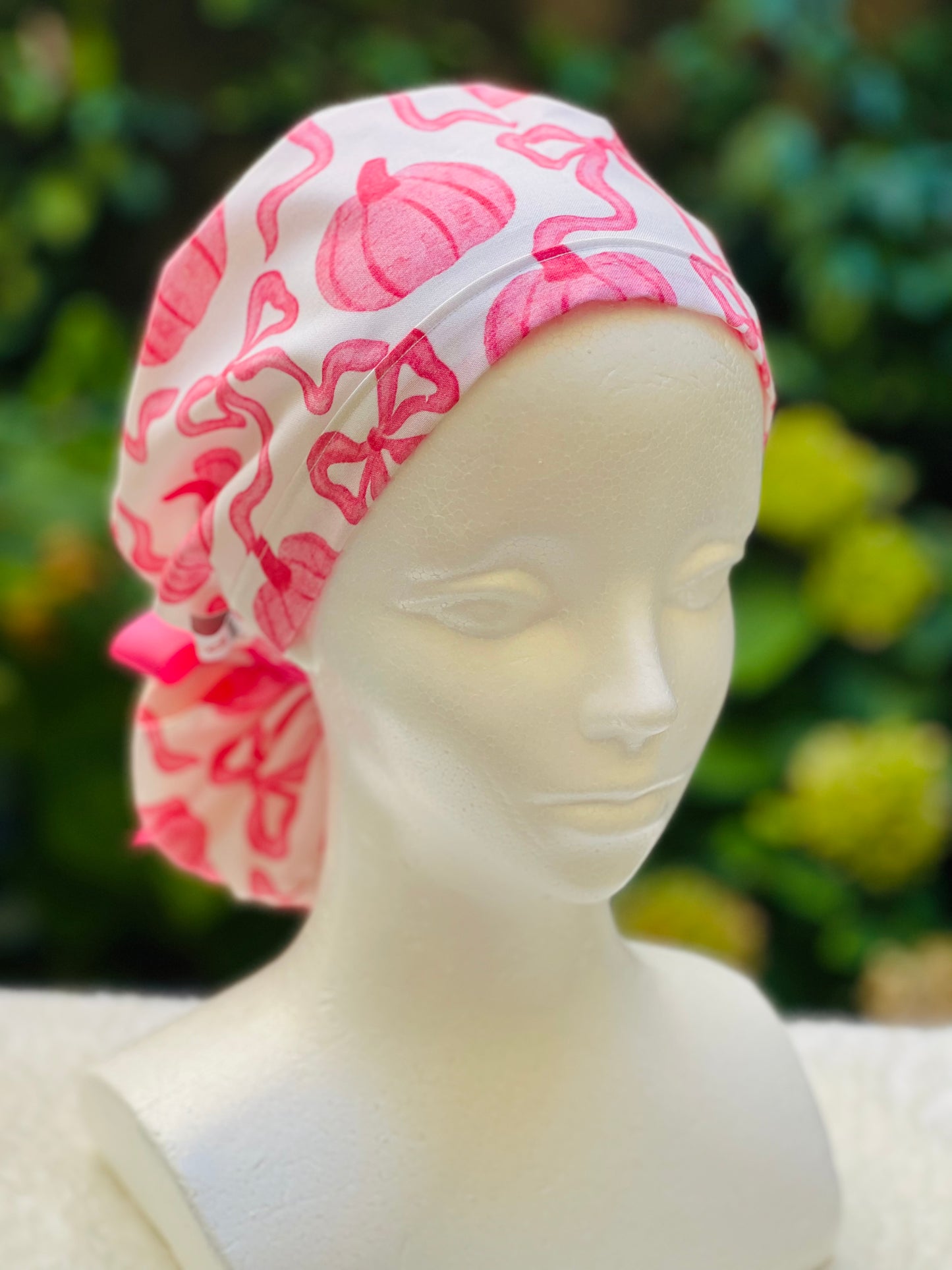 Pink pumpkin with bow scrub cap