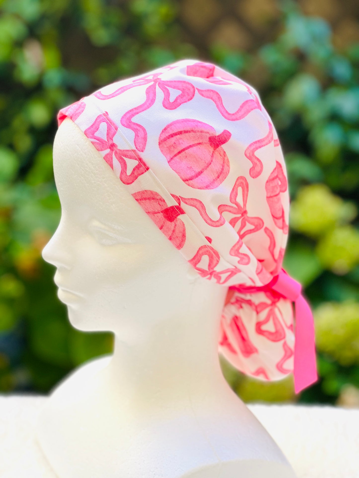 Pink pumpkin with bow scrub cap
