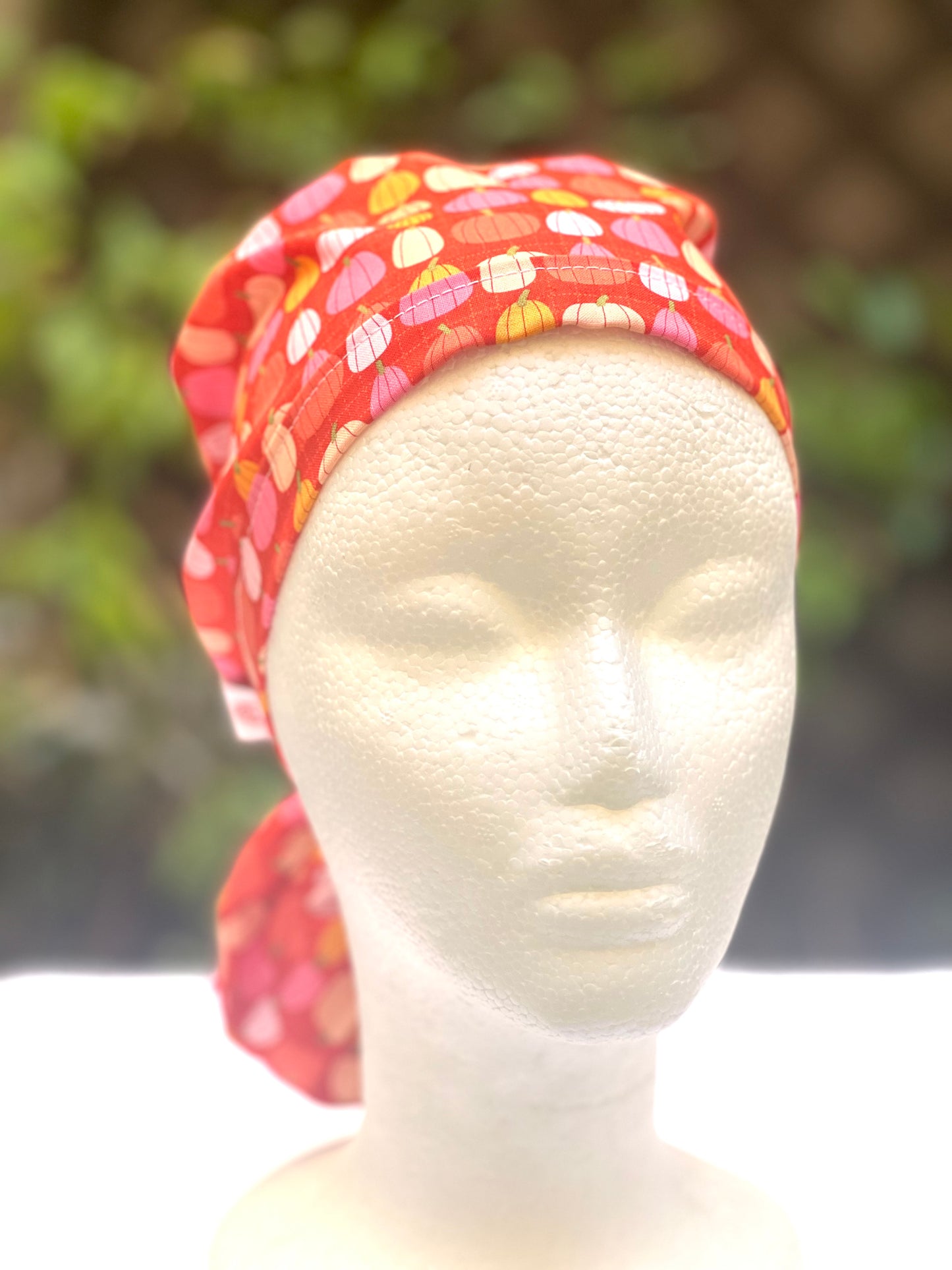 Pink pumpkin in orange Ponytail scrub cap