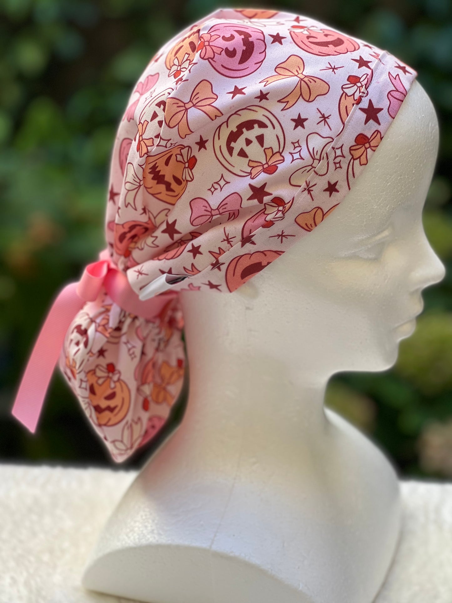 Pink pumpkin with bow scrub cap